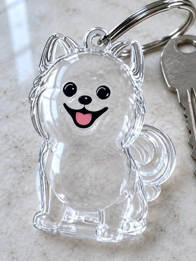 A close macro photograph of the clear hollow body of a puppy-shaped acrylic keepsake keychain visibl